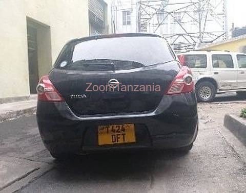 Nissan Tiida.      2005 - 2/6