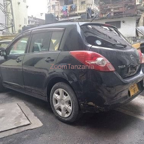 Nissan Tiida.      2005 - 6/6