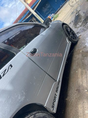 Starlet. Glanza.    2002 - 2/5