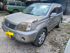X  Trail.      2003