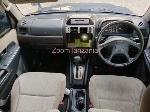 Pajero io.     2005 - 2/6