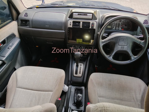 Pajero io.     2005 - 5/6
