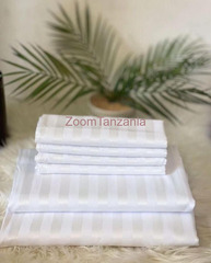 *Quality white strip bedsheet size 7*8 2bedsheet, 4pillowcase.
